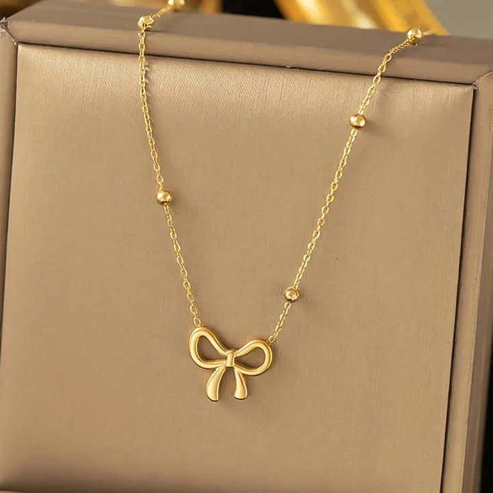 طقم قلادة وأقراط وسوار على شكل فيونكة - Stainless Steel Bow Necklace Bracelet Earring