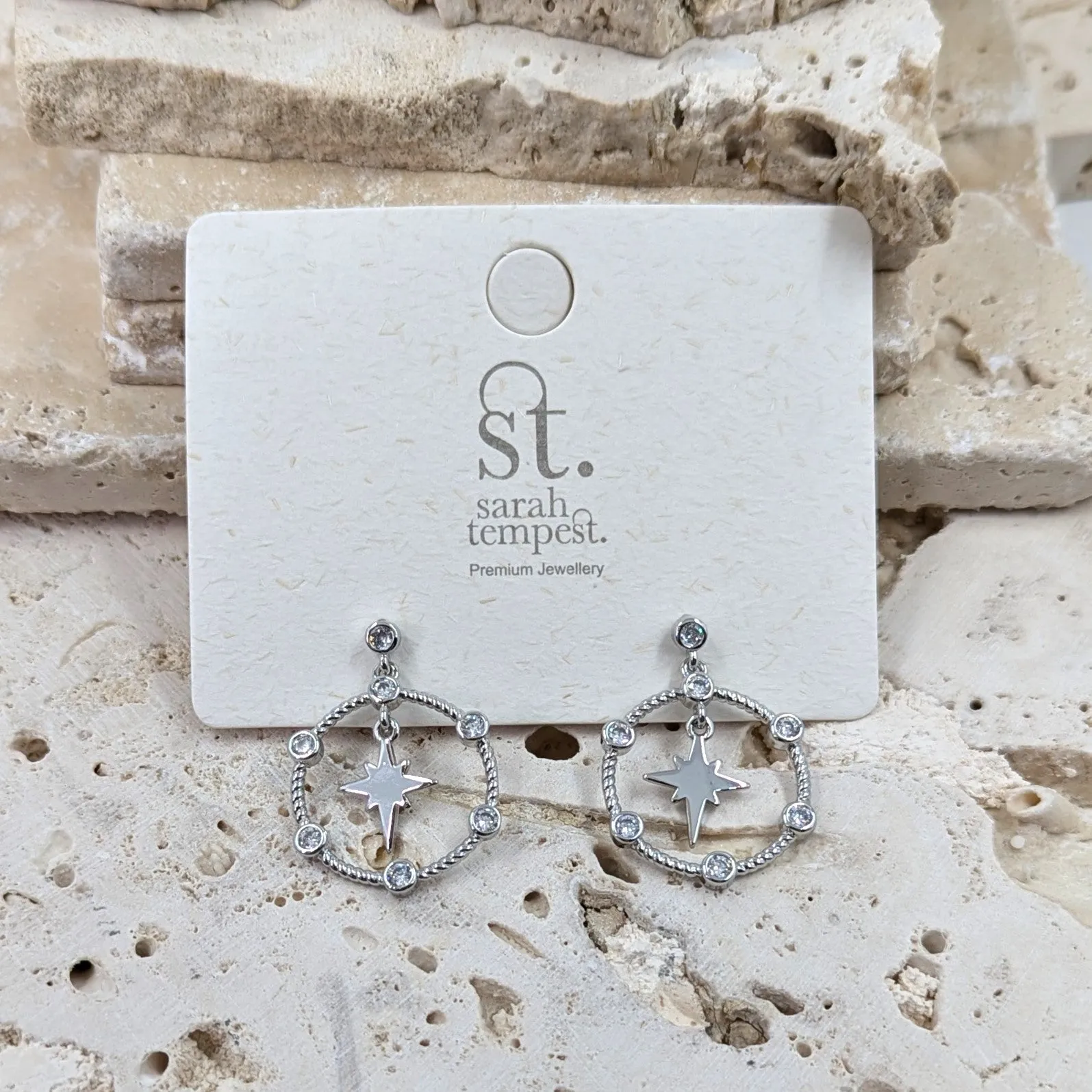 Circle and CZ drop earrings with 8 point hanging star element